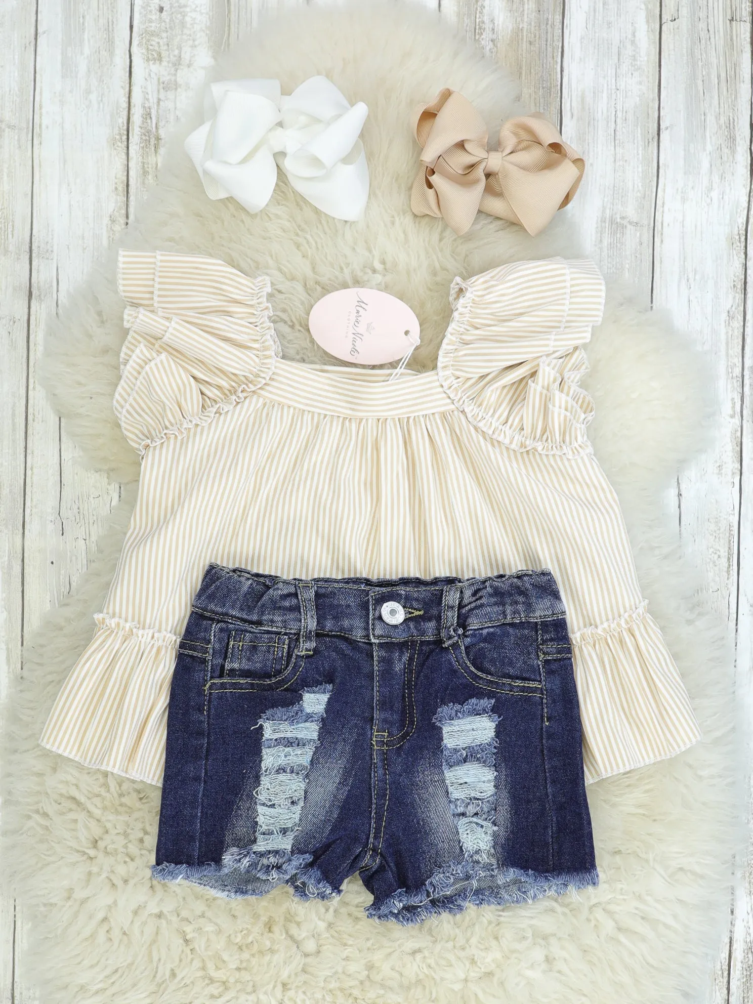 Cream Ruffle Top & Distressed Denim Outfit